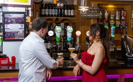 Couple enjoying drinks at a cosy hotel bar
