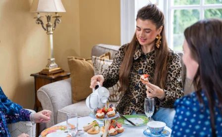 Group enjoying afternoon tea in cosy hotel lounge