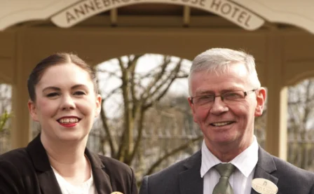 Friendly hotel staff welcoming guests at Annebrook House Hotel entrance.