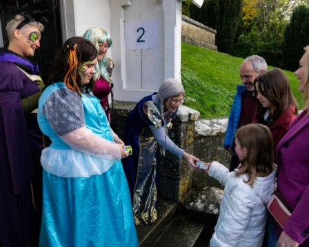 Family enjoying a costumed event at a hospitality venue.