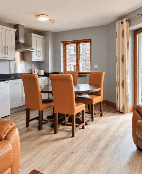Cosy hotel suite with dining area and comfortable seating for families.