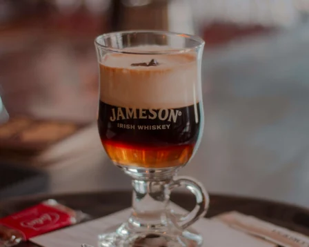Irish coffee served on a café table, surrounded by warmth and hospitality.